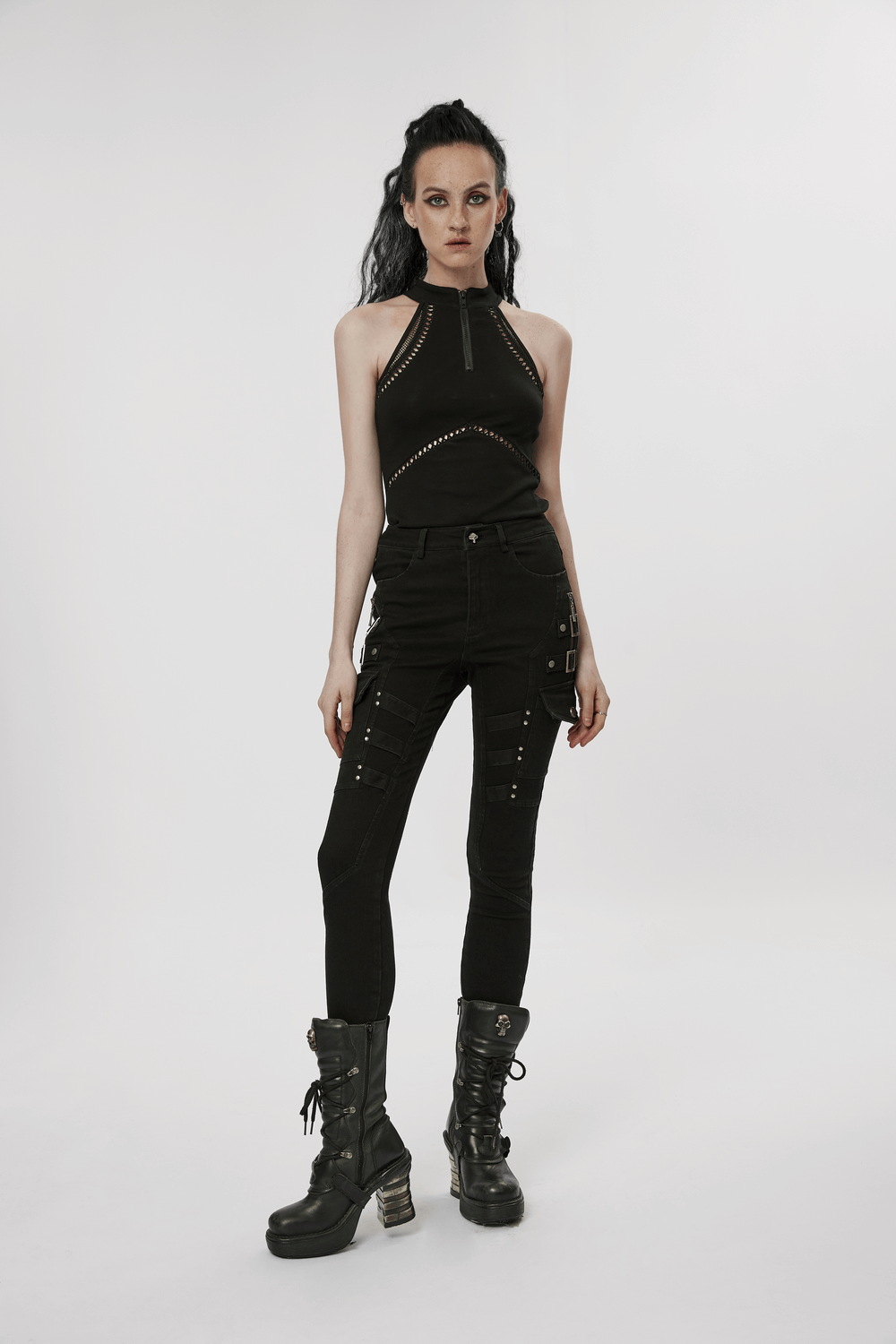 Urban Punk Zippered Skinny Jeans with utility loops, paired with a stylish black top and edgy black boots.