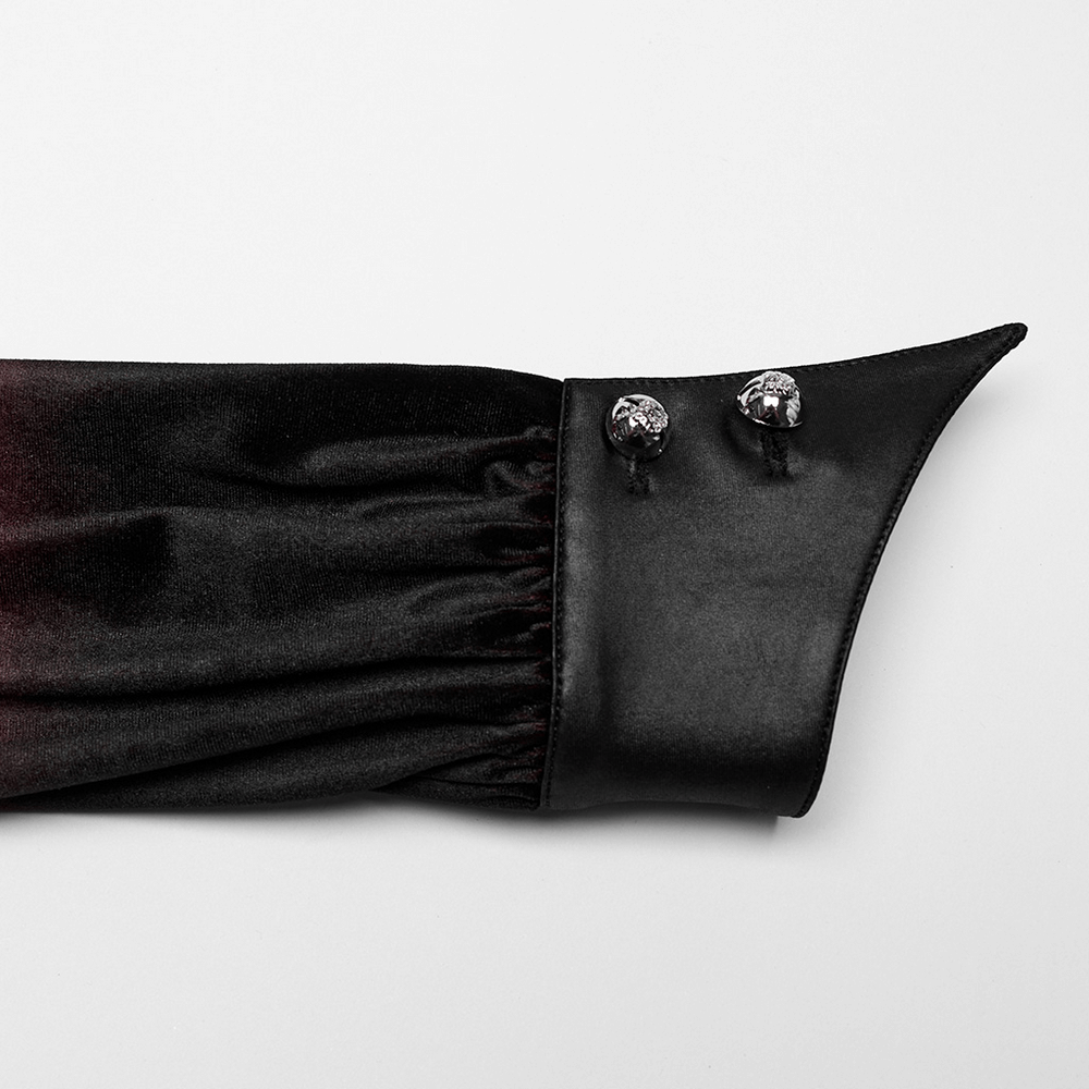 Close-up of bell sleeve cuff featuring carved buttons on velvet shirt, highlighting gothic style and intricate design.