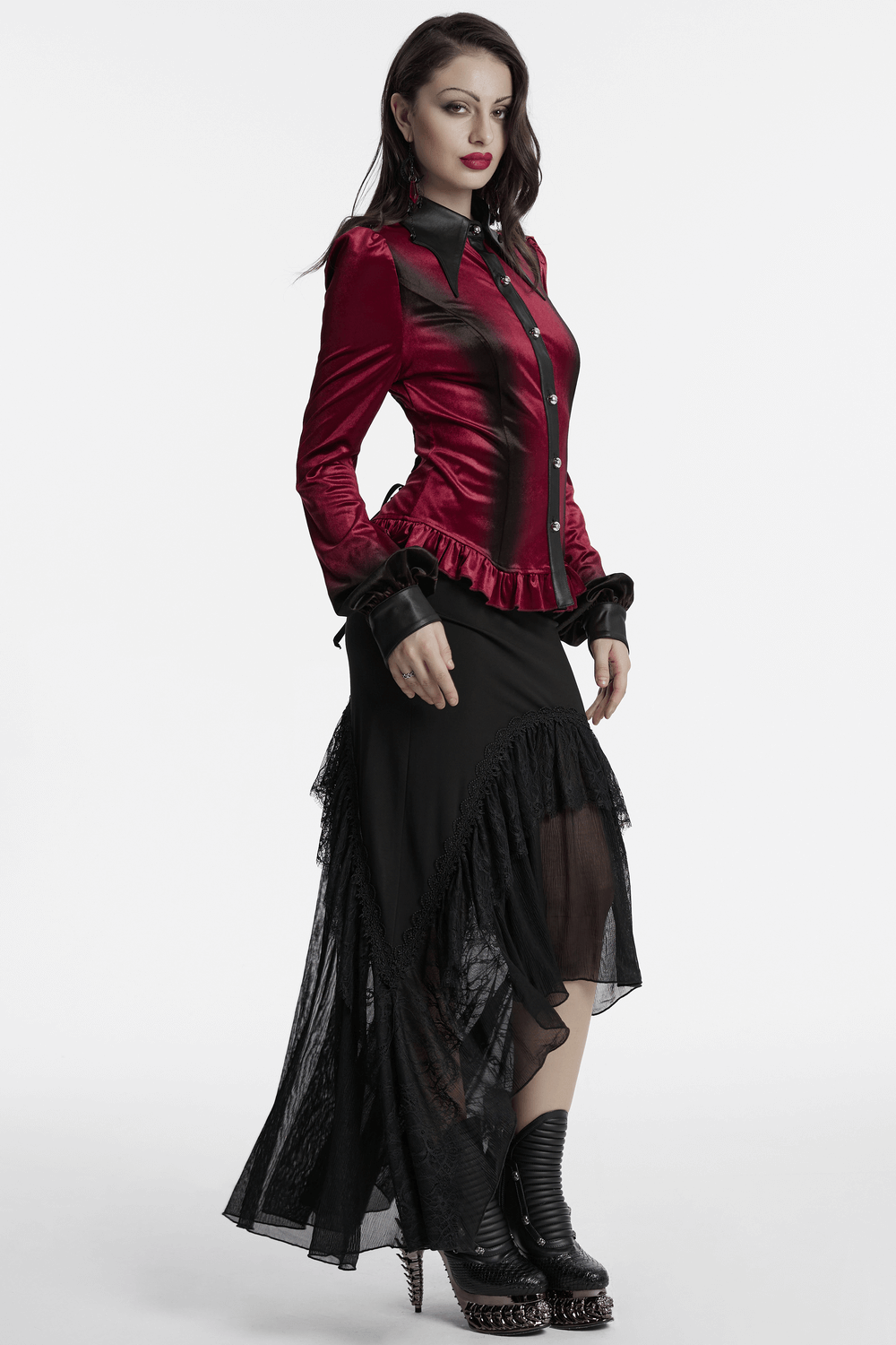 Gothic velvet batwing shirt with lace-up back and ruffled hem, styled with a flowing black skirt for a dramatic look.