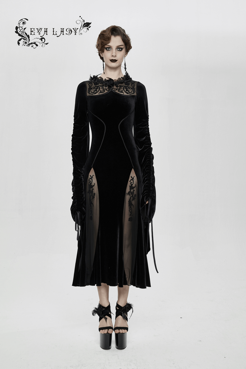 Elegant velvet black gothic dress with filigree patterns and wide adjustable sleeves, perfect for a gothic wardrobe.