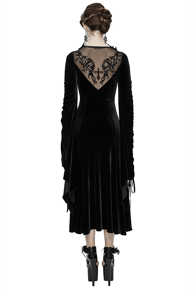 Elegant women's velvet black dress with filigree patterns and wide adjustable sleeves, perfect for gothic style lovers.