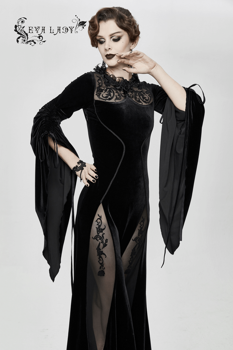Elegant women's gothic velvet black dress with filigree patterns and wide sleeves, perfect for a gothic wardrobe.
