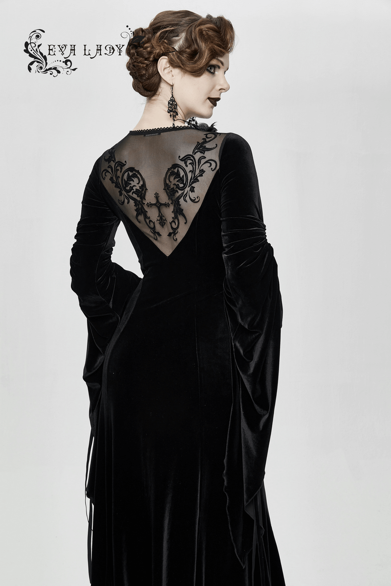 Elegant women's velvet black dress with filigree patterns and wide adjustable sleeves, showcasing a stunning back design.