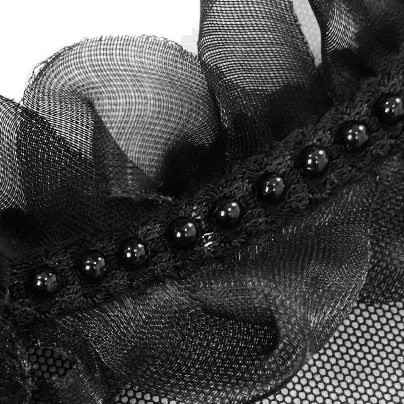 Close-up of delicate black lace trim featuring ruffled edges and decorative beads for gothic style clothing.