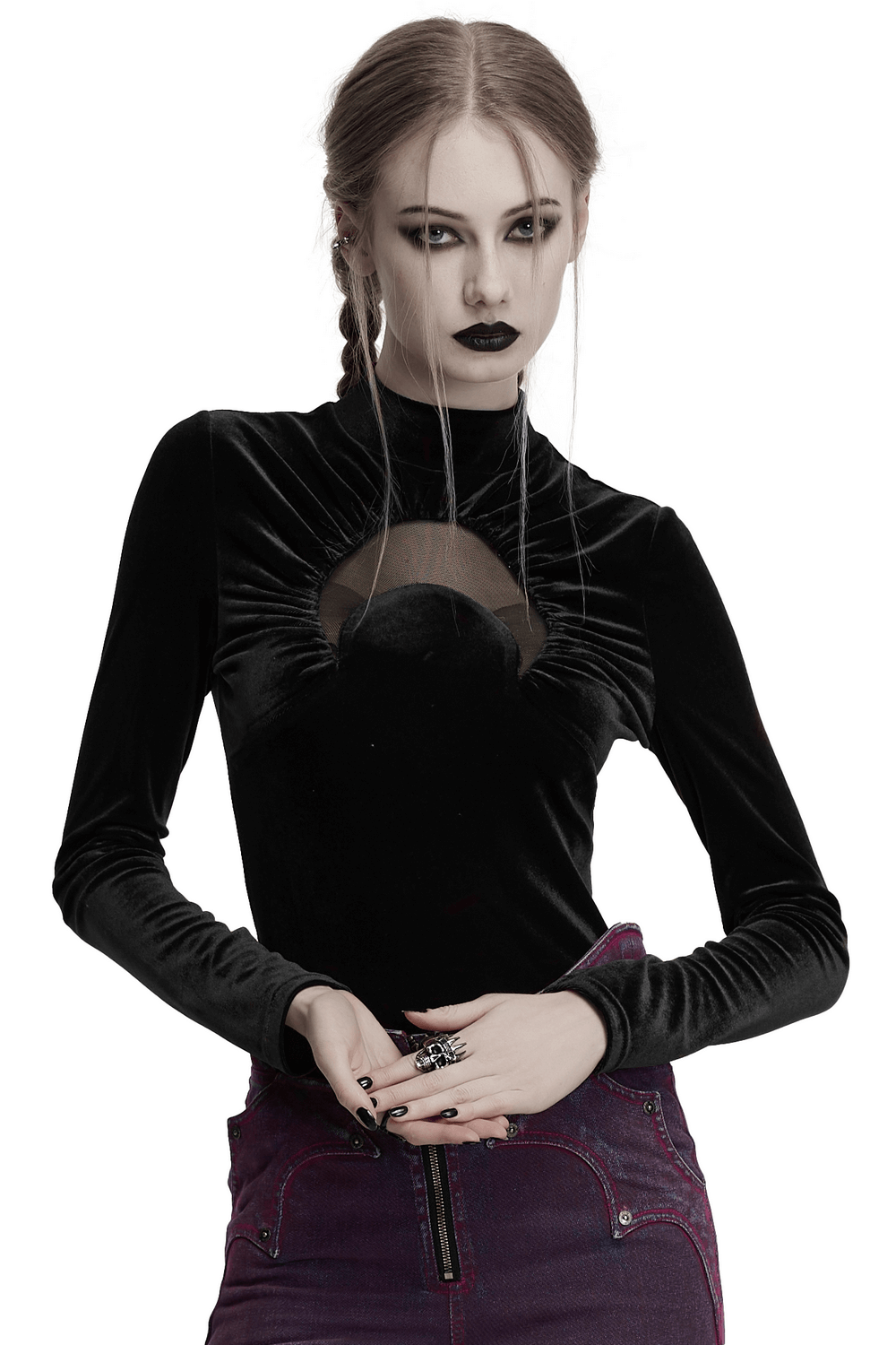 Model wearing a black velvet crescent cut-out top with a stand-up collar, showcasing an edgy alternative fashion style.