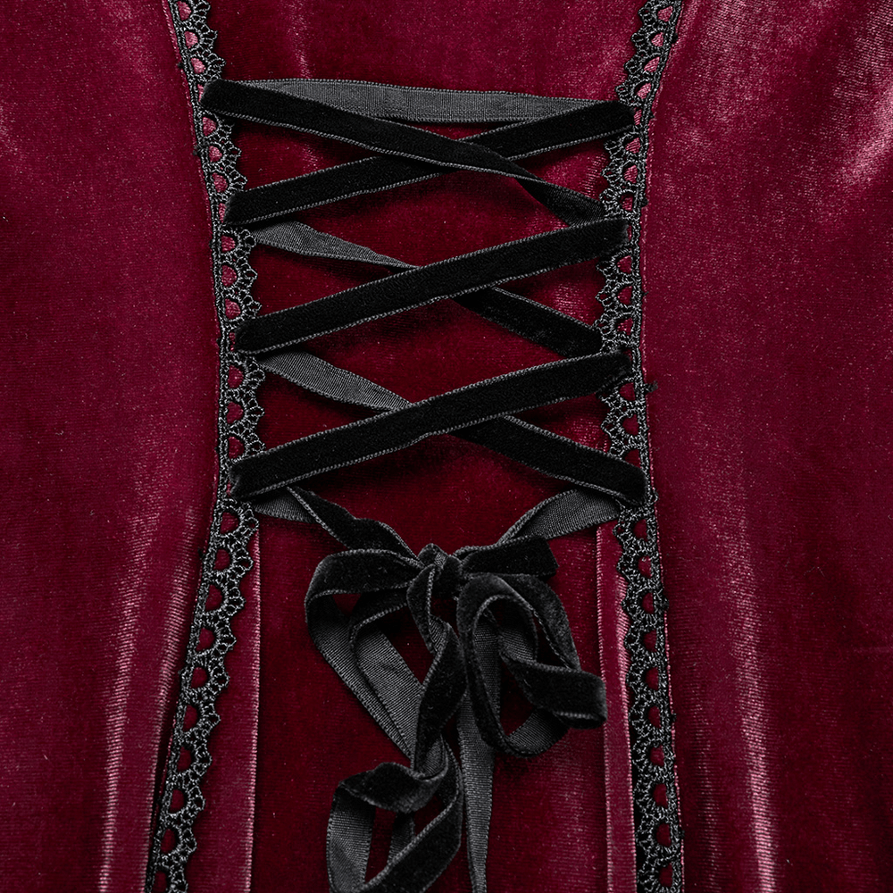 Close-up of a gothic velvet dress with lace-up corset back in deep burgundy, showcasing elegant black ribbon detailing.