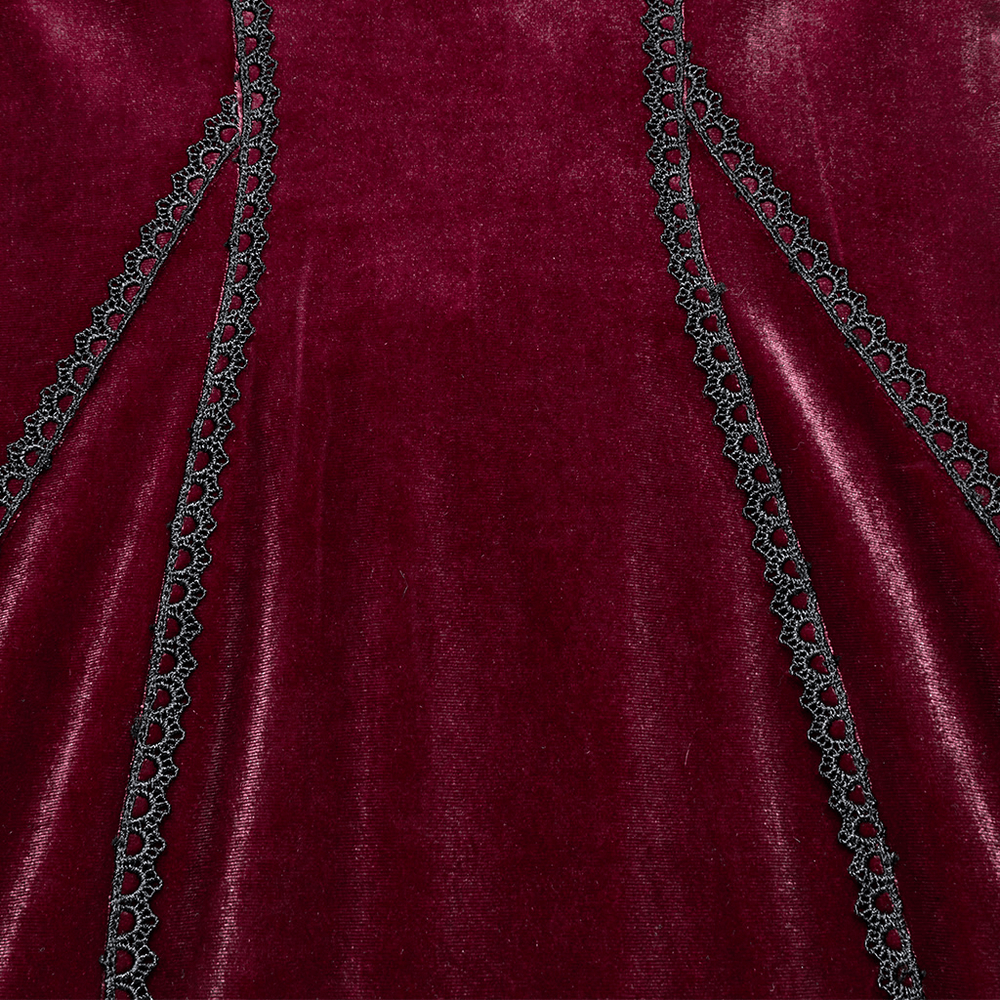 Close-up of burgundy velvet dress showing lace detailing and elegant textile texture, perfect for gothic fashion enthusiasts.