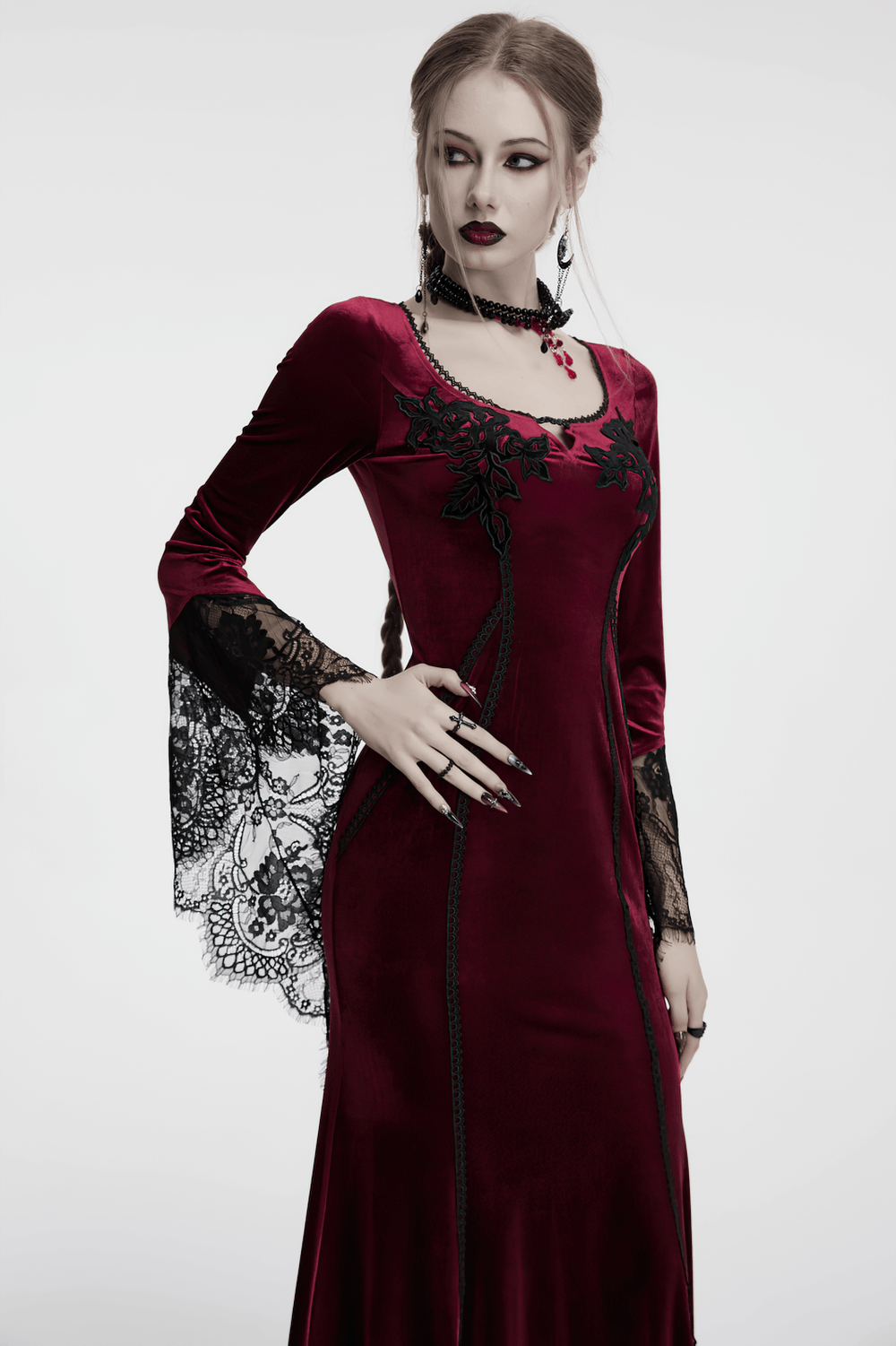Goth velvet dress with lace bell sleeves and rose embroidery, perfect for a dramatic style.