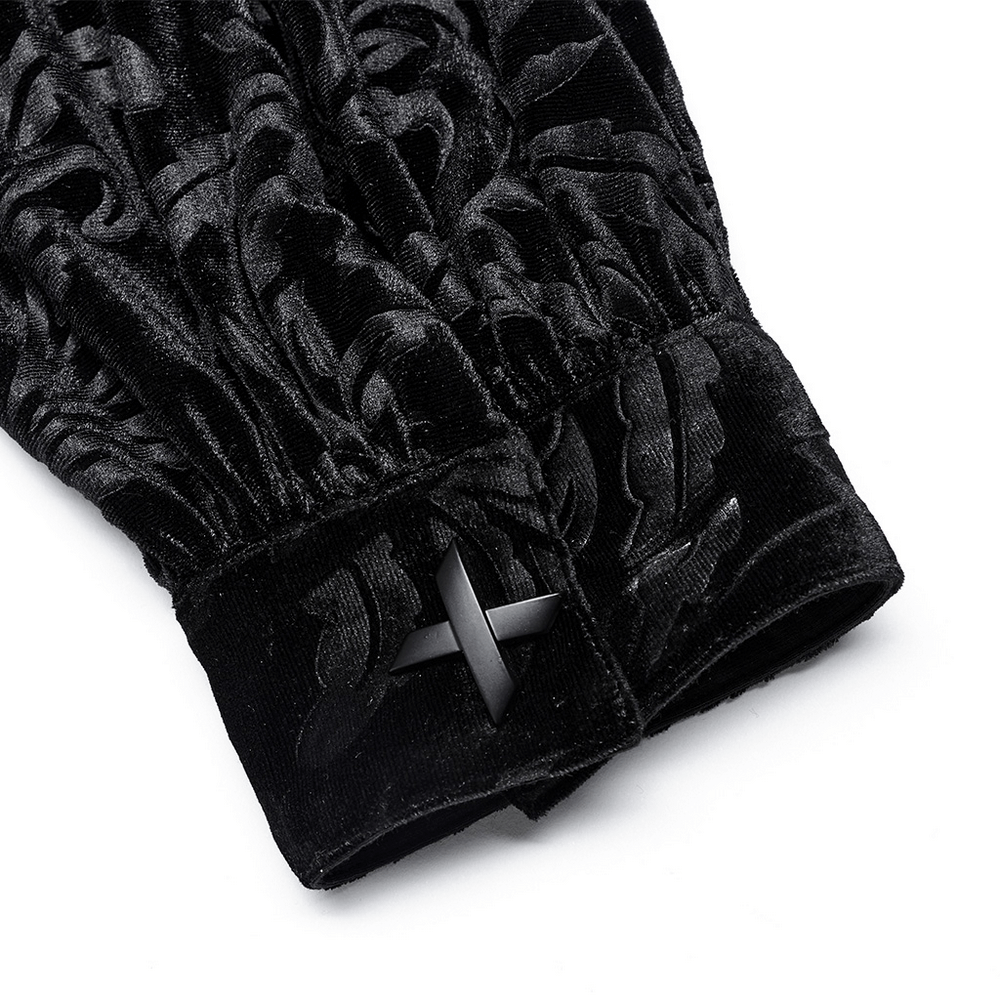 Close-up of the cuff of a velvet embossed gothic shirt showcasing intricate texture and stylish black snap button.