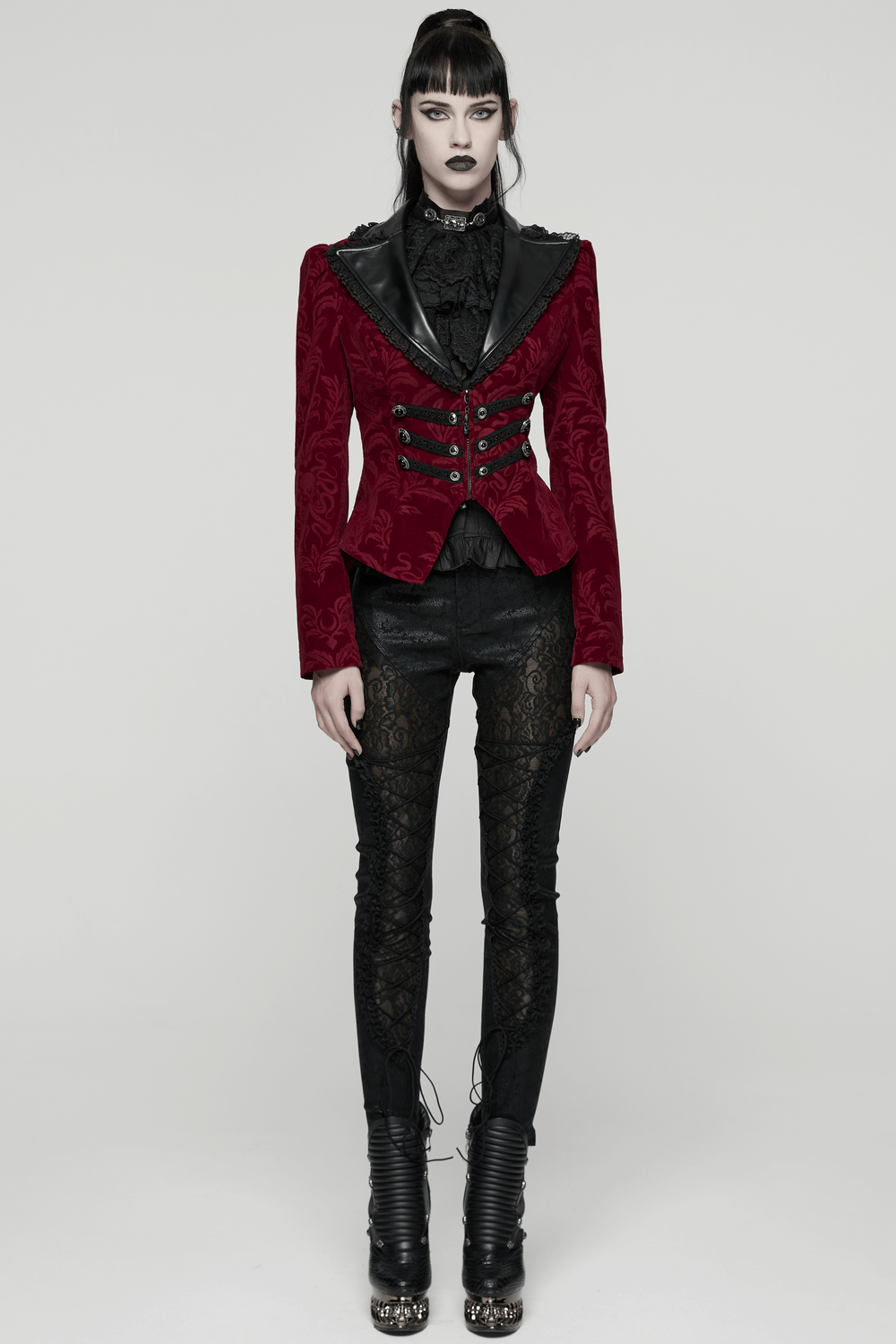 A model showcases a Velvet Embossed Jacket with Leather Details and Lace, featuring a cinched waist and intricate gothic style.