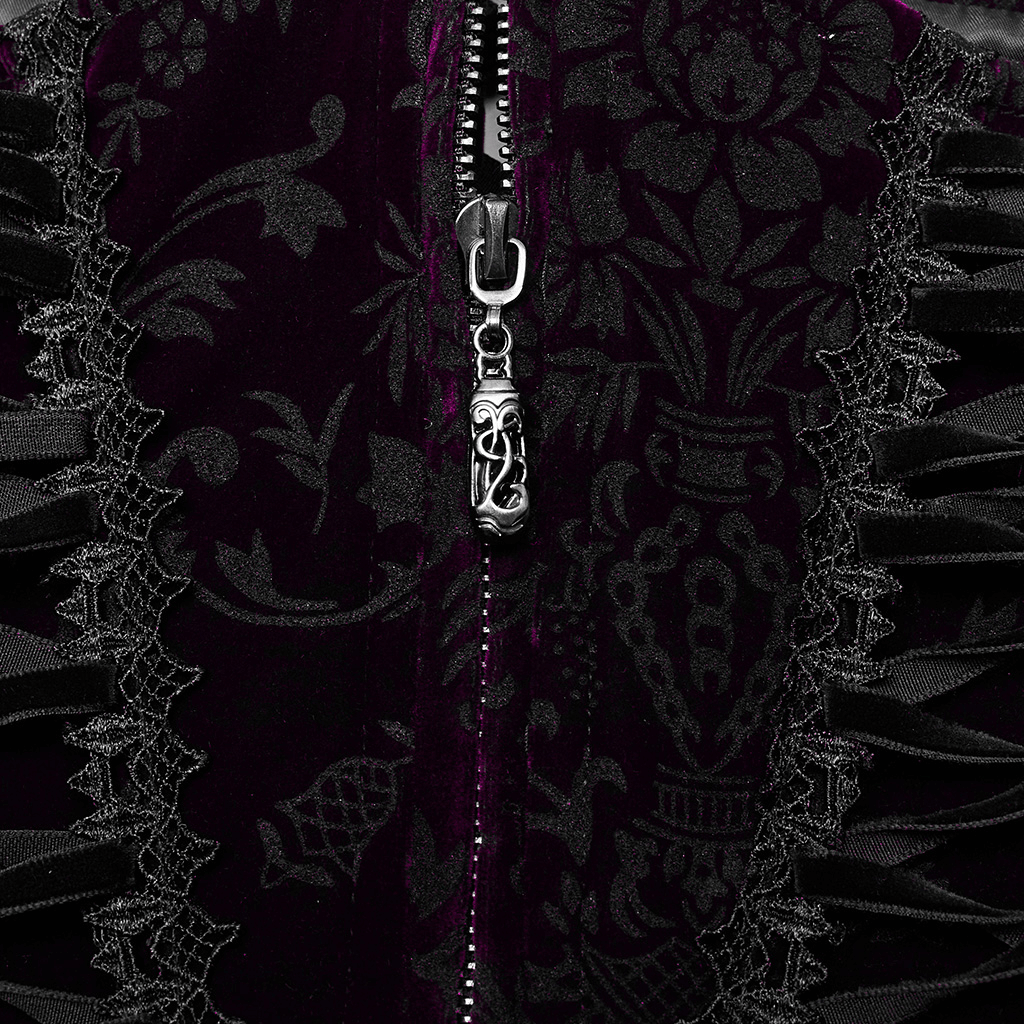 Close-up of velvet goth corset with intricate lace trim and front zipper, showcasing gothic elegance.