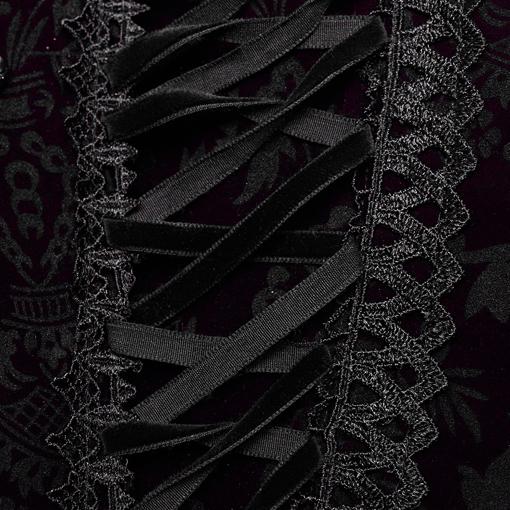 Close-up of black velvet corset lace trim and drawstrings, showcasing gothic elegance and intricate detailing.