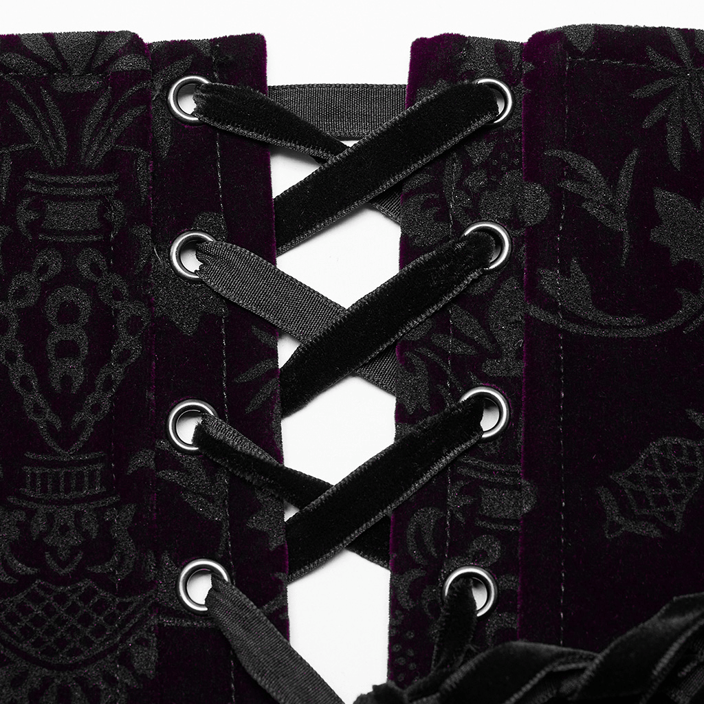 Close-up of velvet goth corset showcasing elegant lace trim and intricate ribbon lacing details.