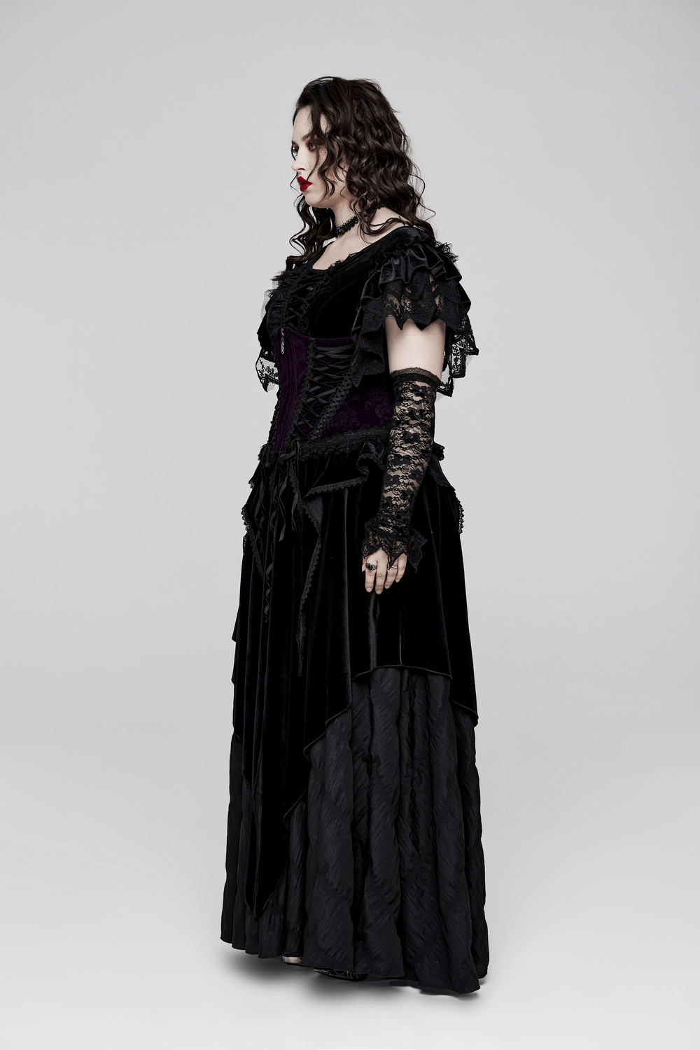 Gothic velvet corset dress with lace trim, showcasing elegance and romantic allure in a striking black design.