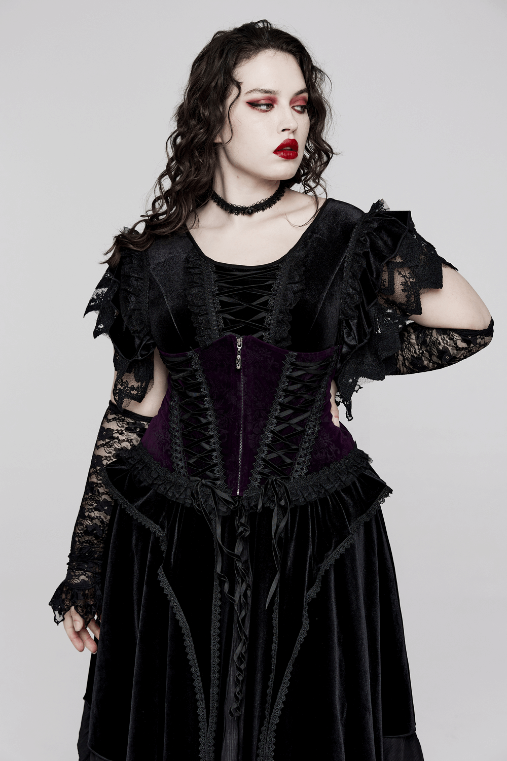 Gothic style velvet corset with lace trim, front zipper, and ruffled sleeves, perfect for a luxurious look.