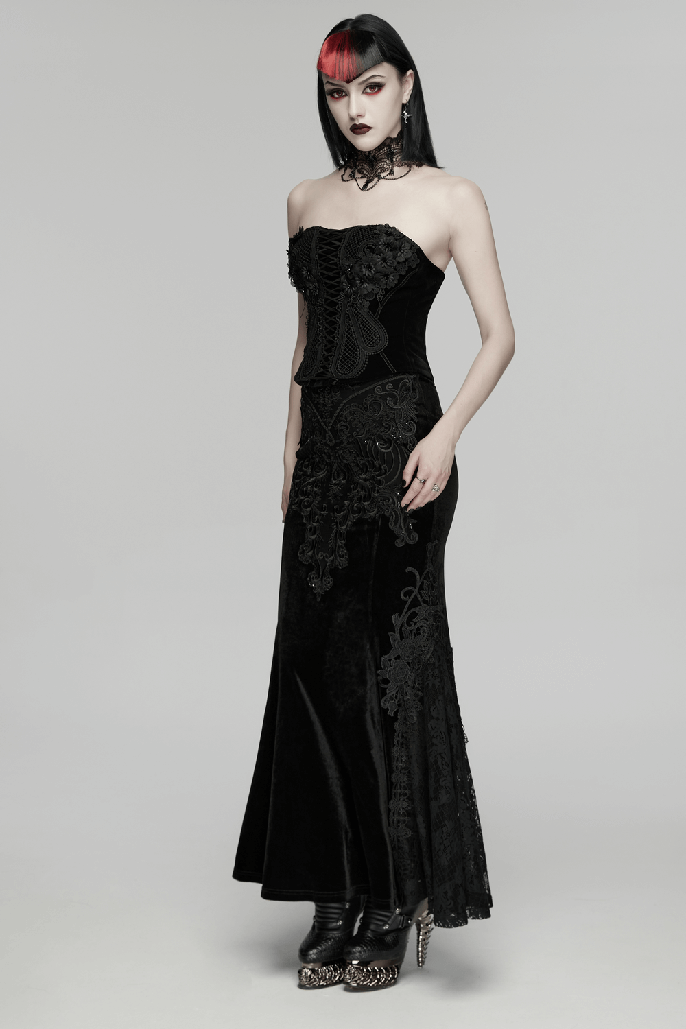 A model wearing a Velvet Goth Skirt with Lace and Sequin Embroidered Detailing, showcasing elegant gothic fashion.