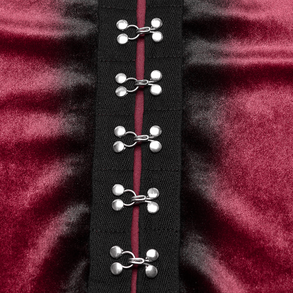 Close-up of gothic velvet top showcasing stylish metal buckles and rich gradient fabric.