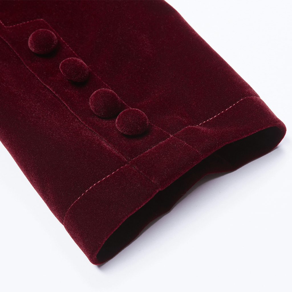 Close-up of a burgundy velvet coat sleeve featuring elegant button details.