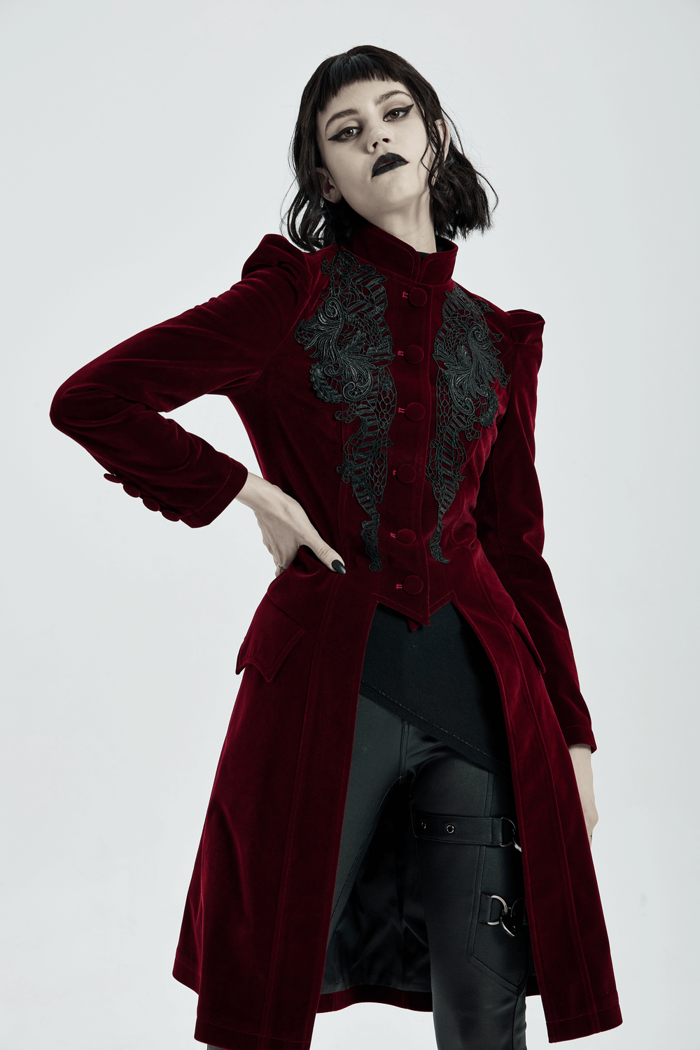 Victorian-inspired velvet gothic coat with intricate lace detail and elegant silhouette.