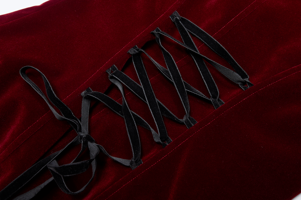 Lace detail on deep red velvet coat showcasing gothic elegance and stylish drawstring design.