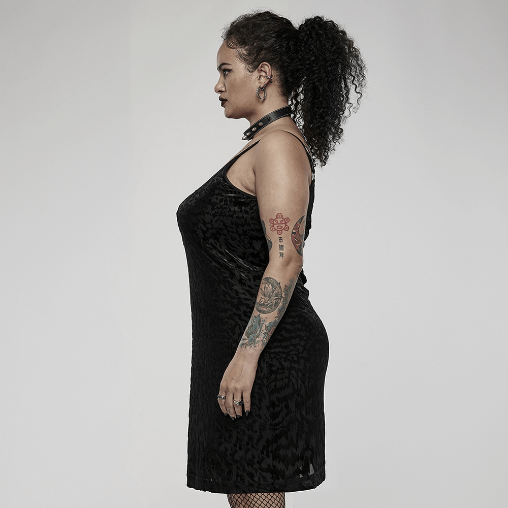 Side view of a model in a velvet gothic dress with a removable strap loop, showcasing bold style and comfort.