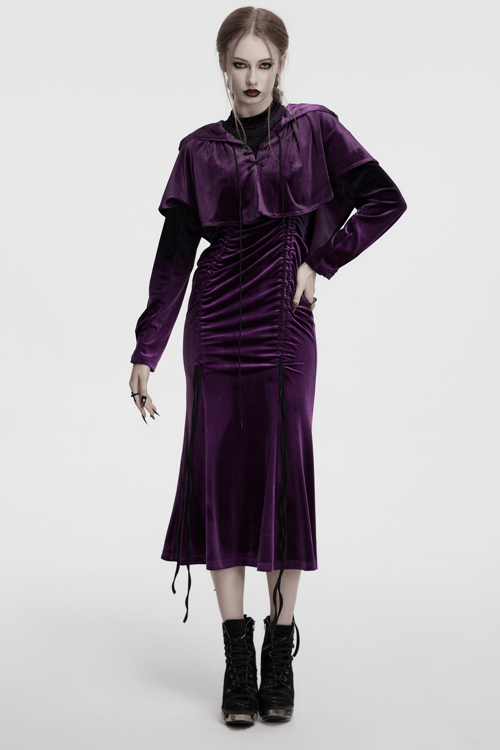 Vibrant velvet gothic dress with adjustable drawstring, pleated detail, and elegant fishtail hem in rich purple.