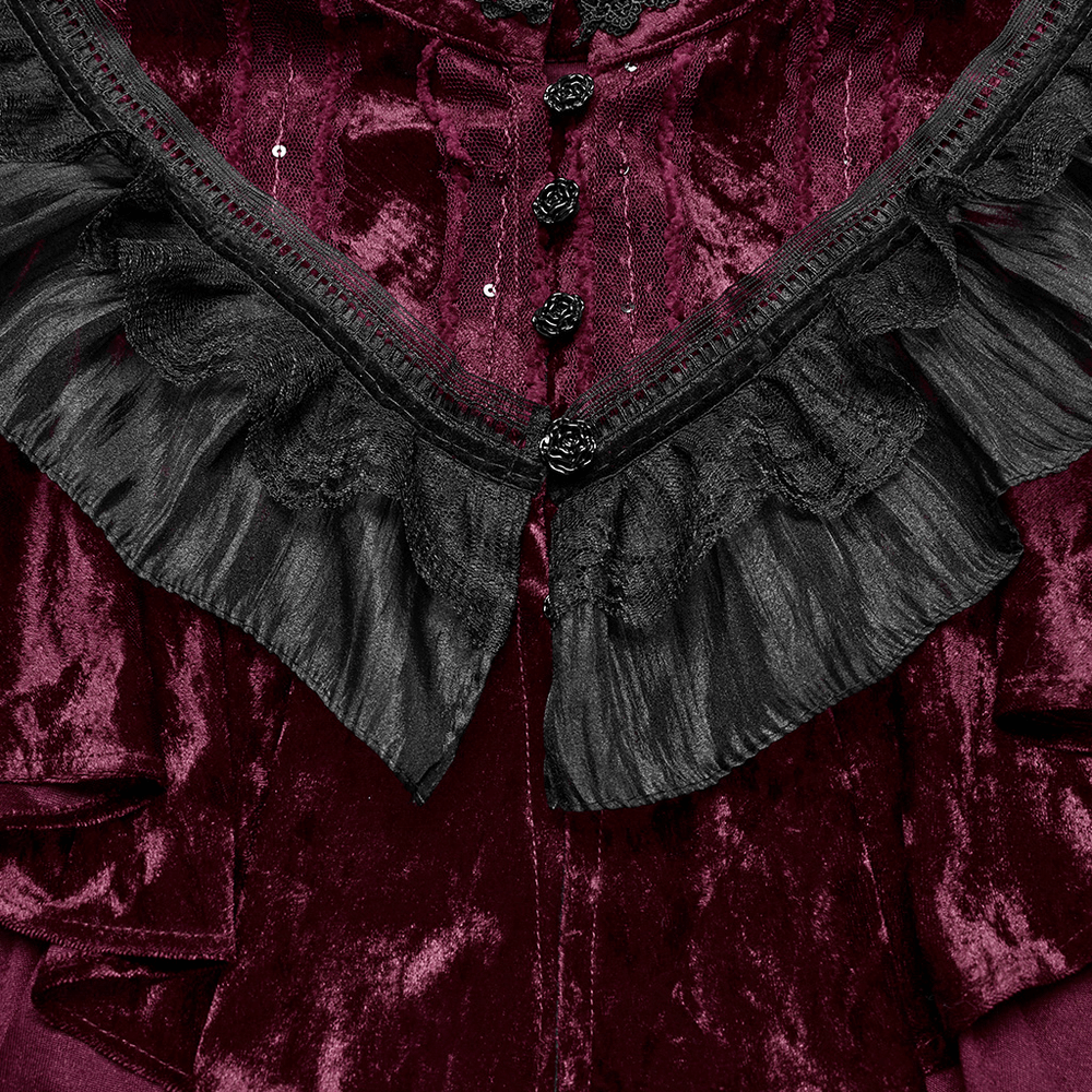 Close-up of a velvet gothic cape featuring elegant black lace ruffles and rose detail buttons, exuding vintage charm.