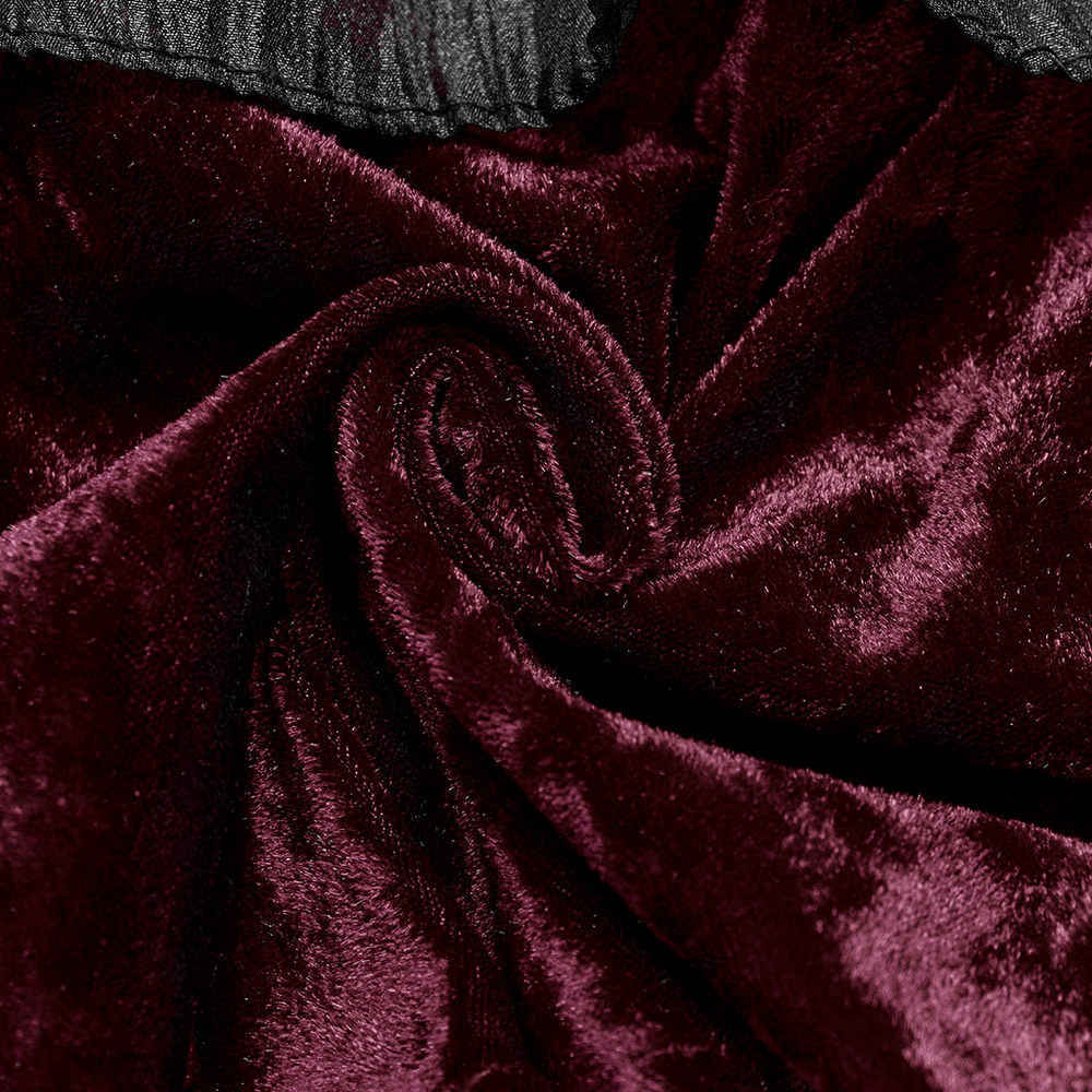Close-up of rich, burgundy velvet fabric, showcasing its smooth texture and luxurious sheen.