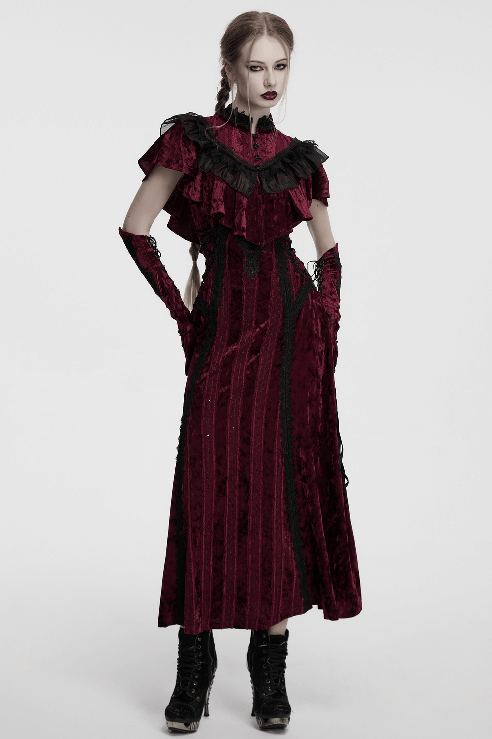Gothic velvet cape dress with ruffled collar and black lace, showcasing vintage elegance in a striking burgundy hue.
