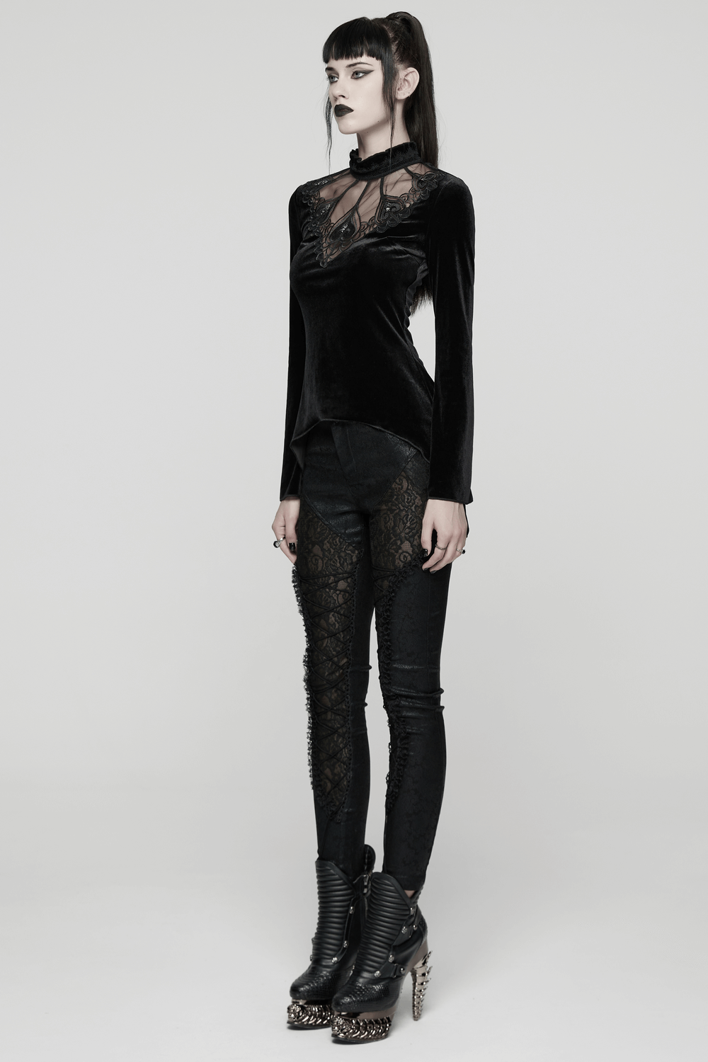 Model showcasing the Velvet Gothic Top with Sheer Lace and Ruffled Collar, styled with edgy black leggings.