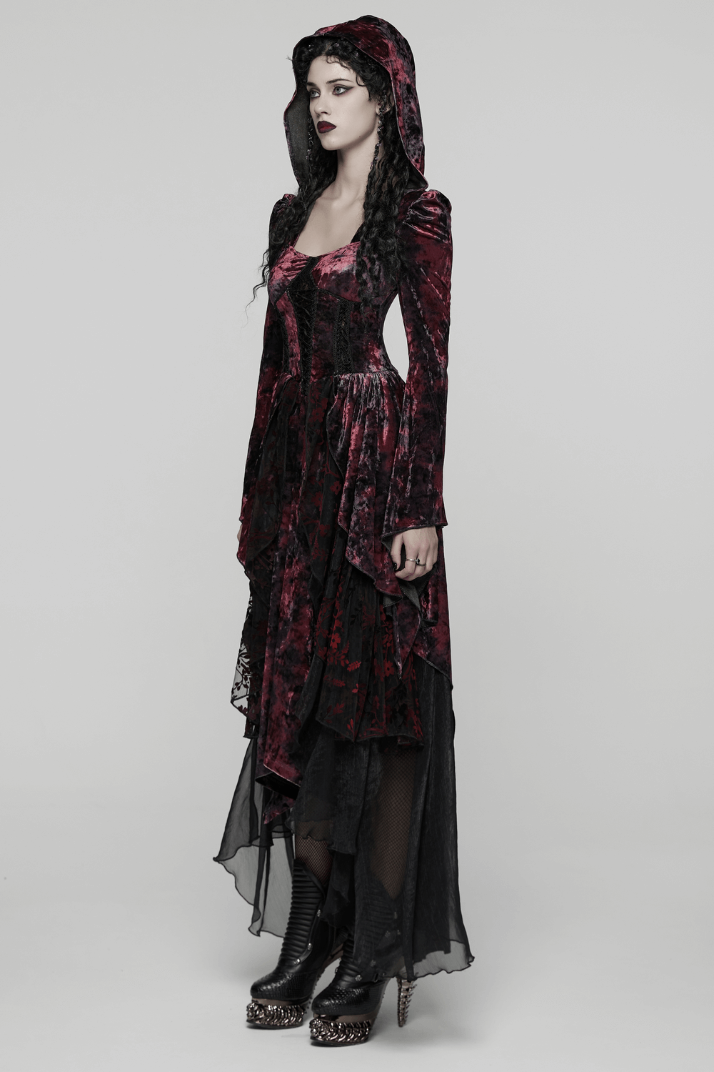 Velvet Gothic Vampire Hooded Dress with Lace Layers displayed on model, showcasing its layered high-low hem and dramatic texture.