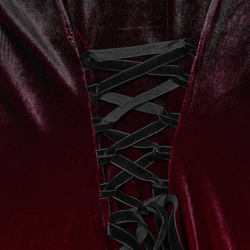 Close-up of the velvet gradient dress's lace-up detail with black straps and a rich burgundy color.