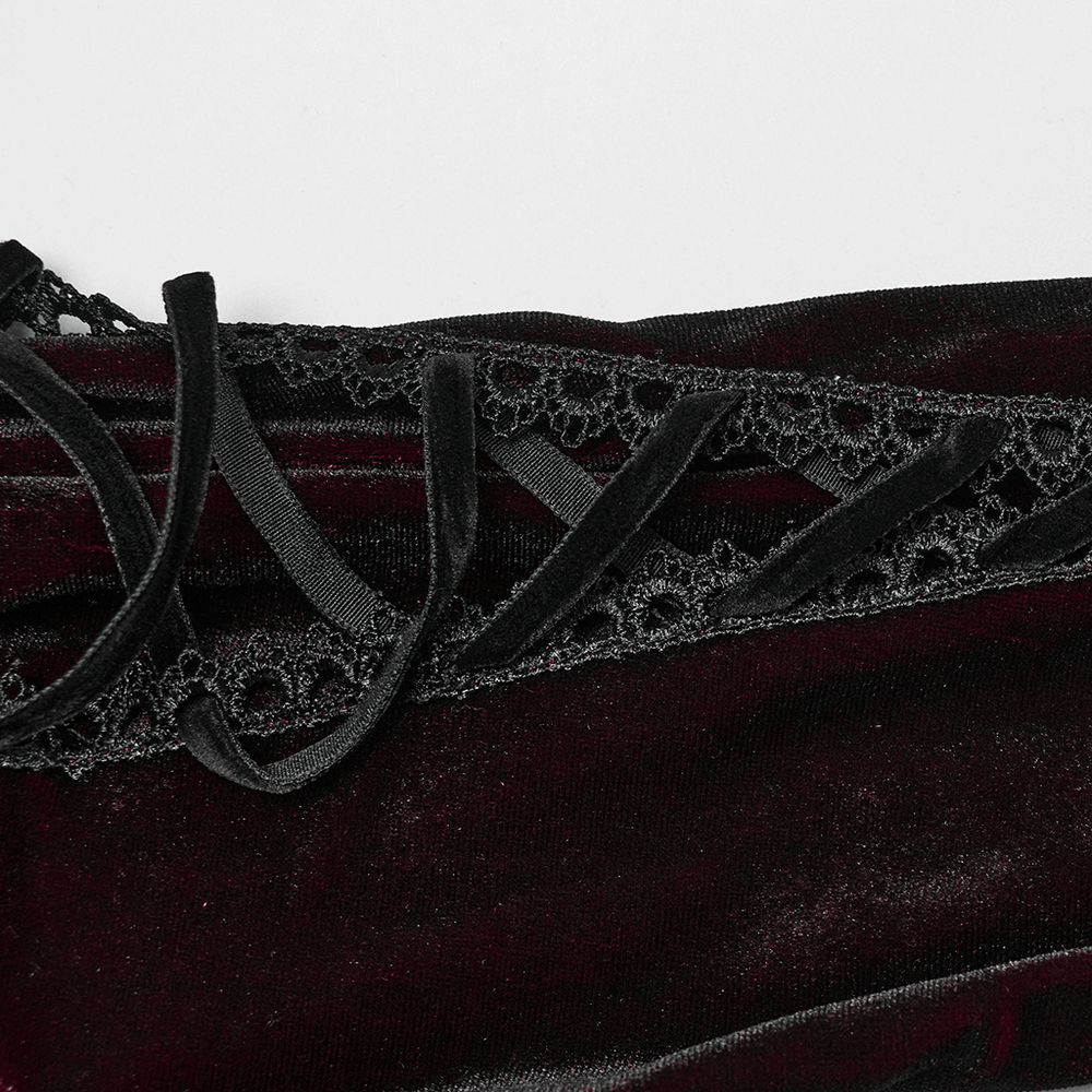 Close-up of lace straps on a velvet dress, showcasing intricate designs and luxurious texture.