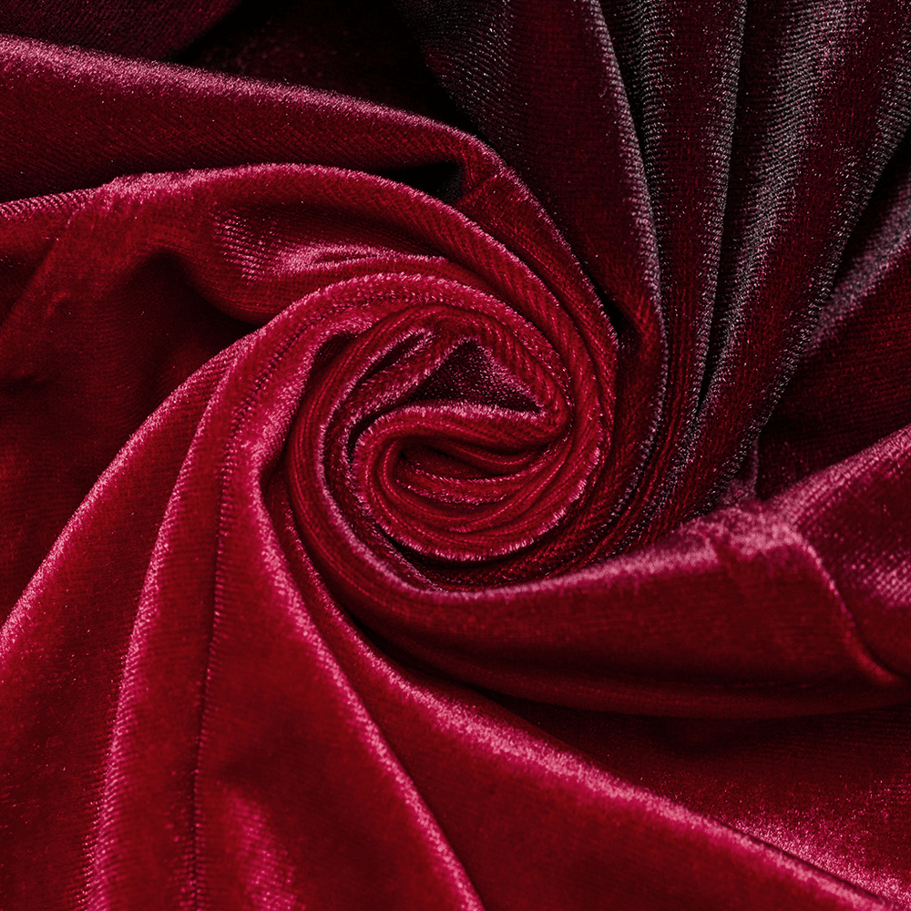 Close-up of luxurious deep red velvet fabric, showcasing rich texture and gradient shades for elegant designs.