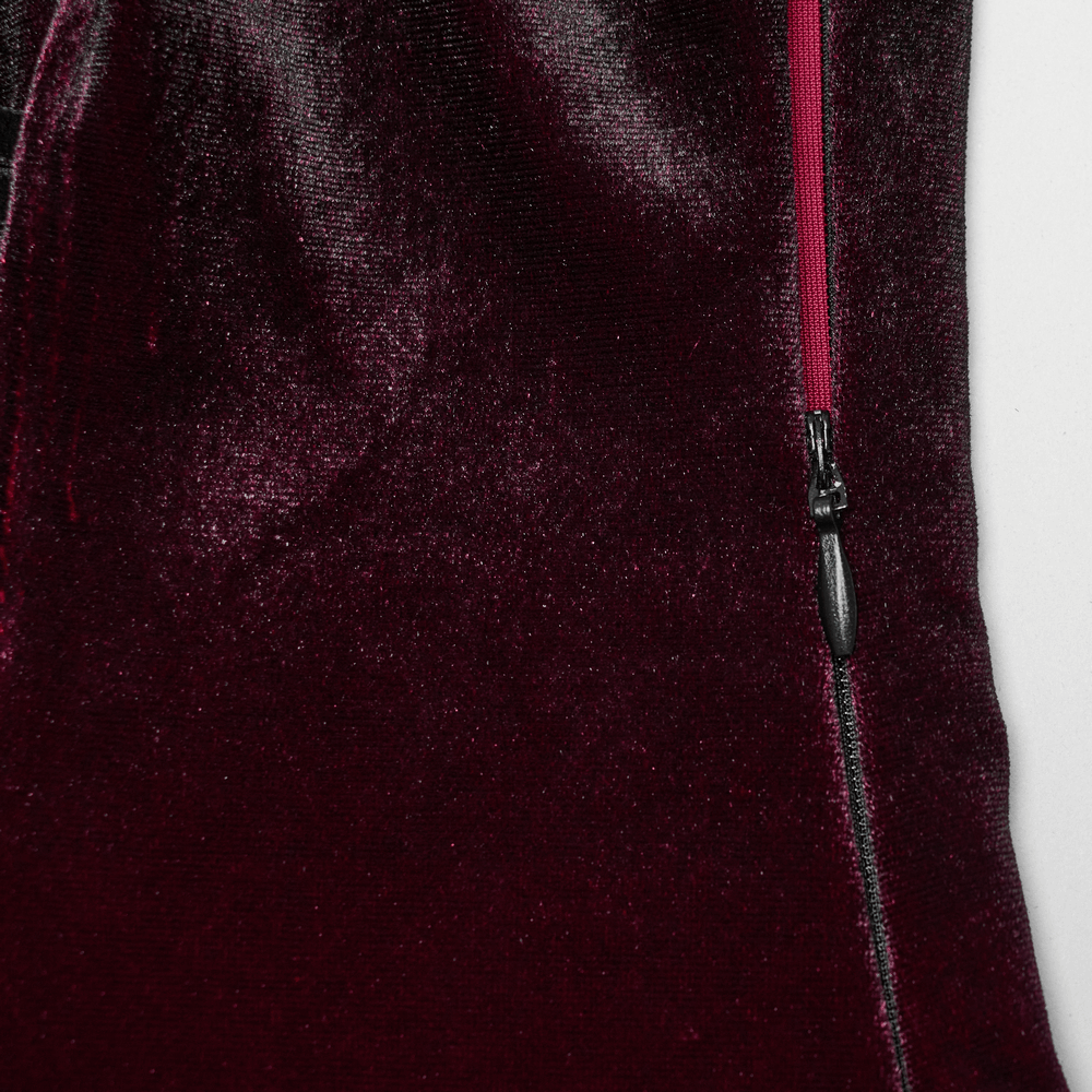 Close-up of the side zipper on a luxurious velvet dress, showcasing rich texture and quality craftsmanship.