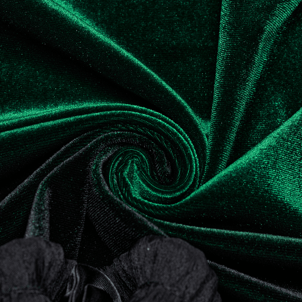 Close-up of soft green velvet fabric, showcasing rich color and luxurious texture, perfect for goth-inspired fashion.