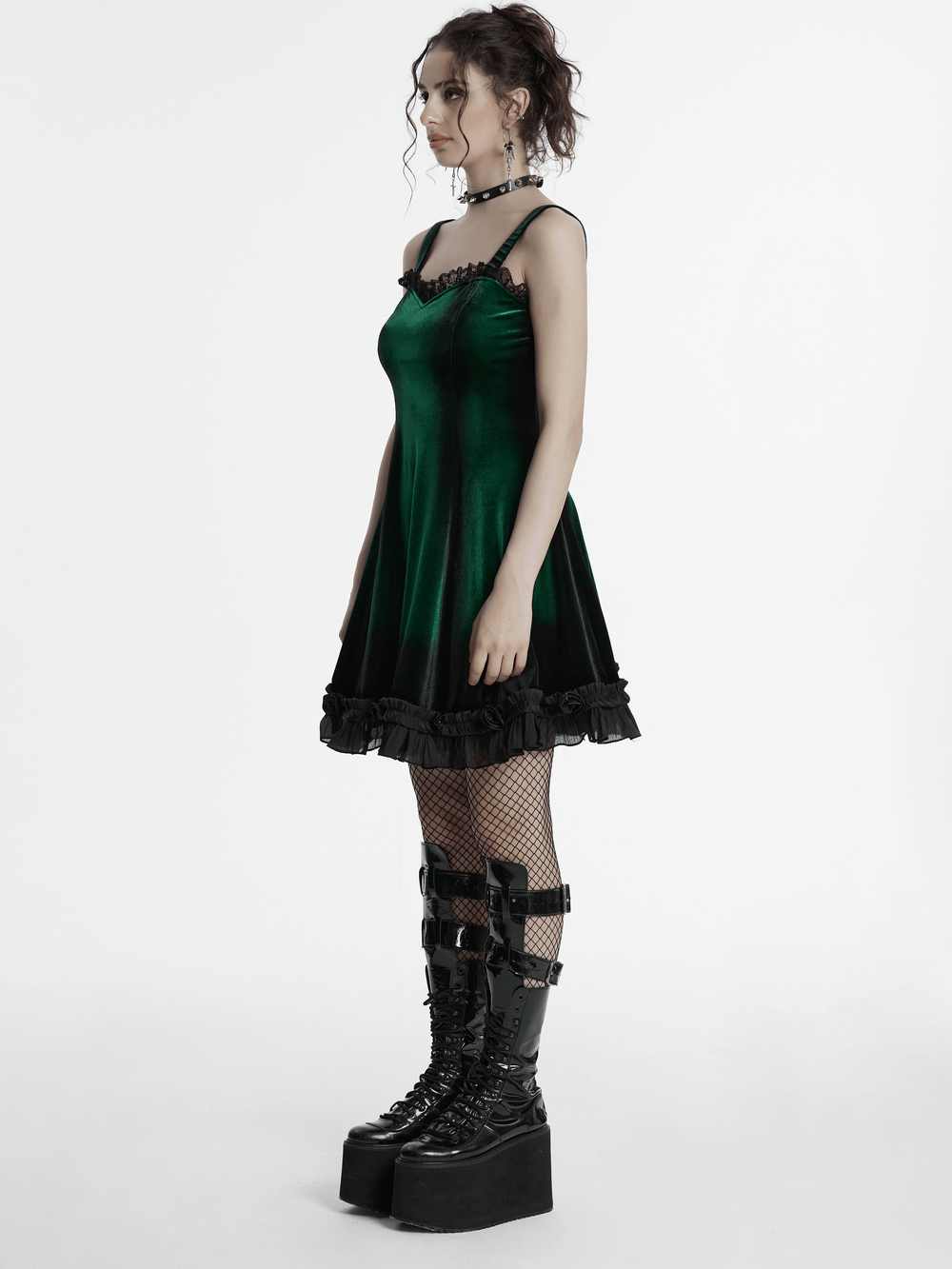 Goth velvet gradient dress in green and black, featuring lace and ruffle details, worn with edgy platform boots.
