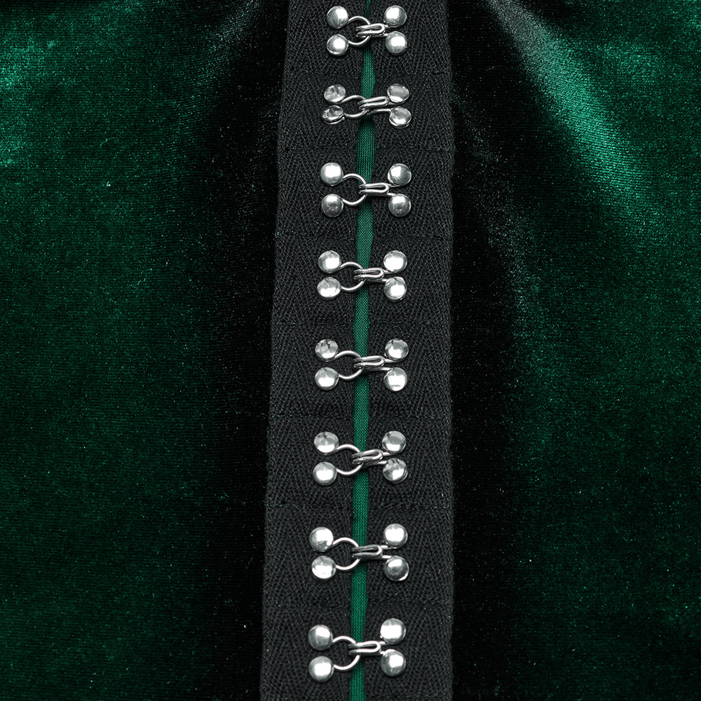 Close-up of elegant metal buckles on a velvet gradient top, showcasing chic gothic style and unique hem design.