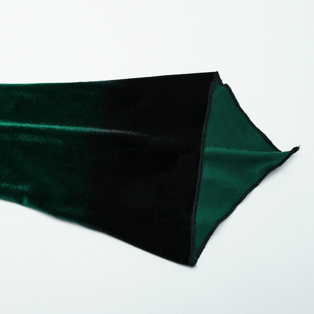 Close-up of black and green velvet fabric showcasing gradient design, perfect for a gothic top.