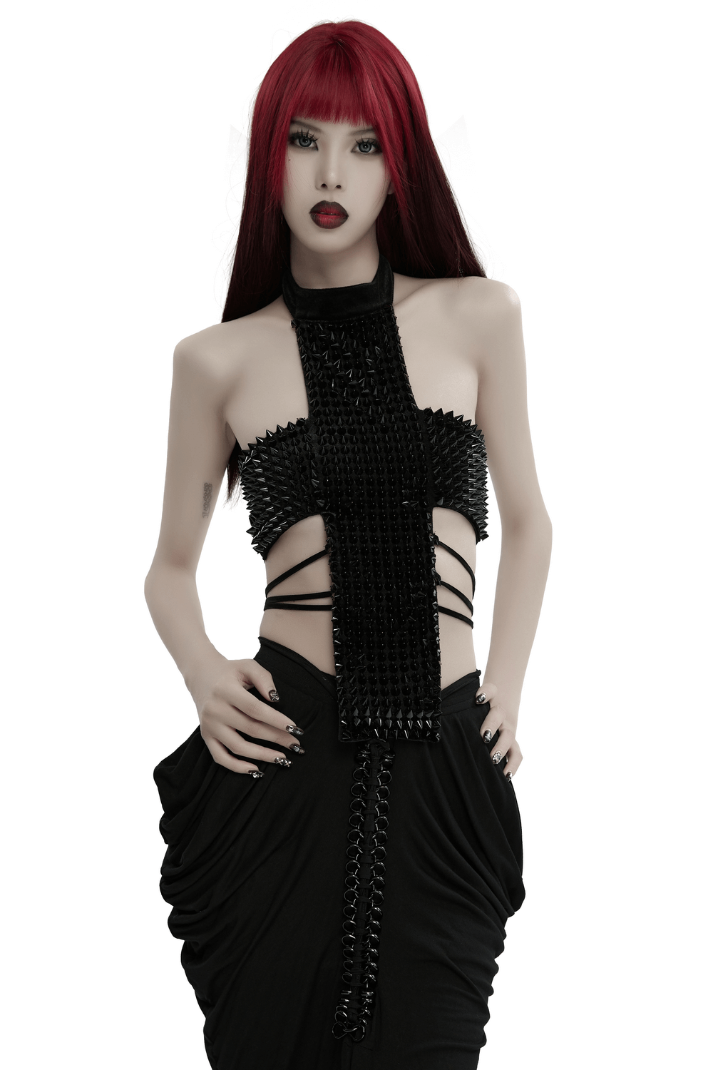 Gothic velvet halter top with spiked rivets and waist straps, perfect for an avant-garde fashion statement.