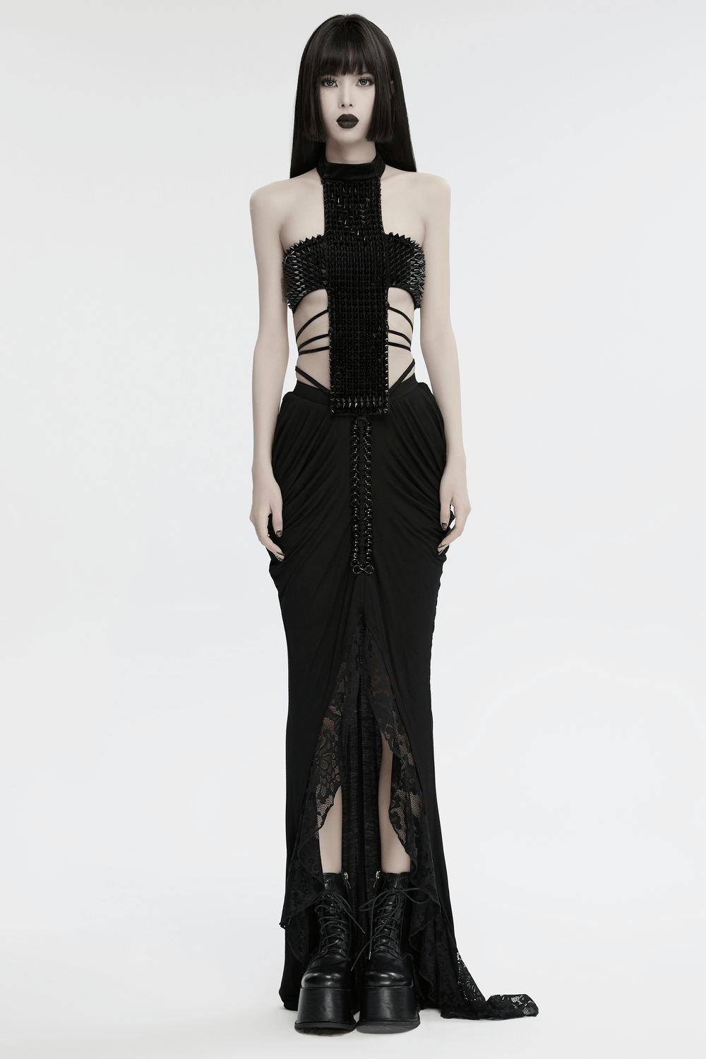 Gothic velvet halter top with spiked rivets and waist straps, blending edgy and futuristic styles.