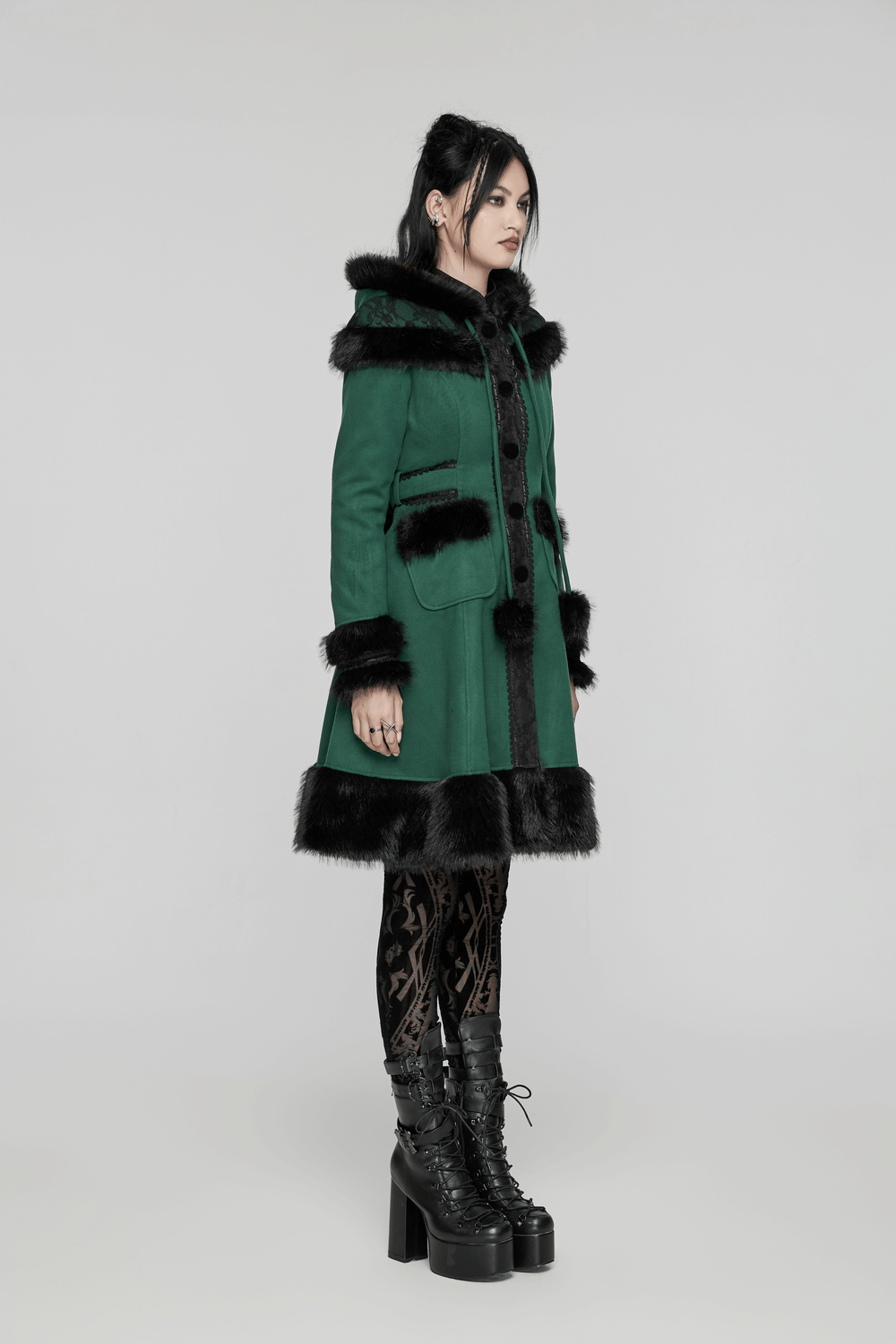 Elegant green hooded coat with faux fur trim, stylish bow detail, and A-line silhouette, perfect for vintage-inspired fashion.