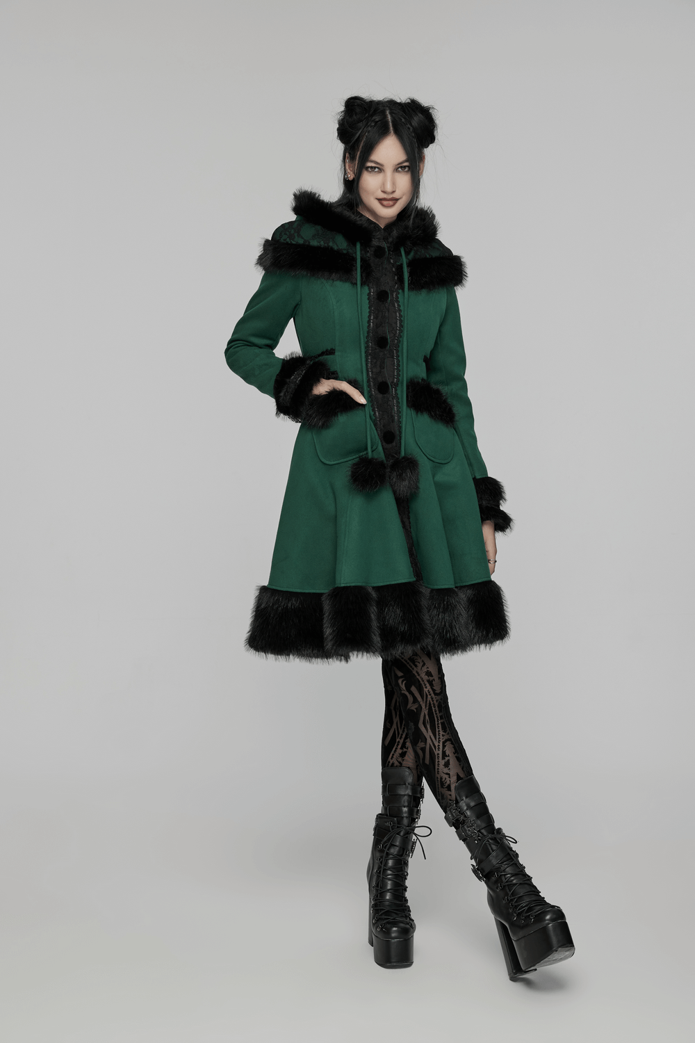 Elegant green velvet hooded coat with faux fur trim, bow accent, and playful pom-poms.