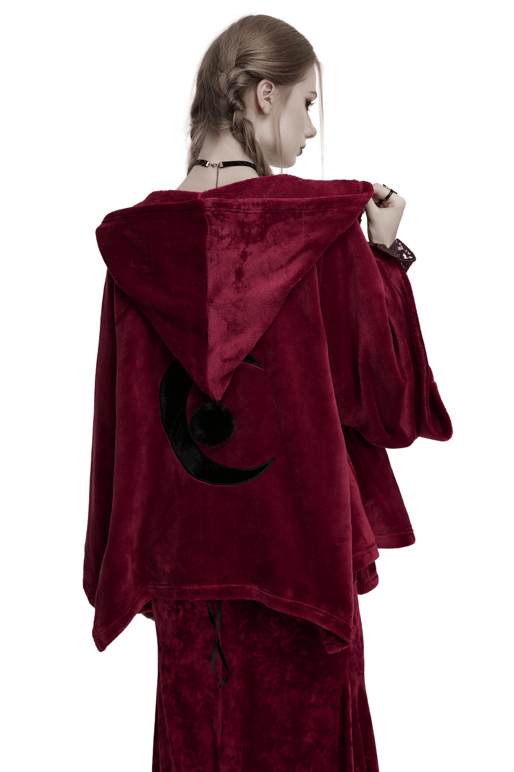 Dark velvet hooded moon cape showcasing unique embroidered back detail, perfect for stylish warmth.