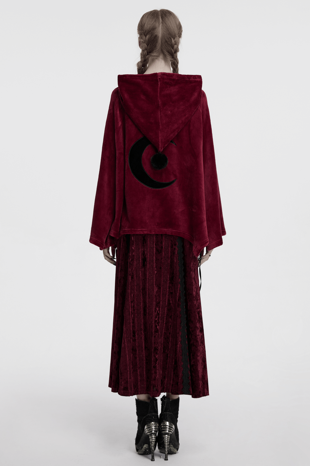 Back view of a stylish dark velvet hooded moon cape featuring unique moon embroidery.