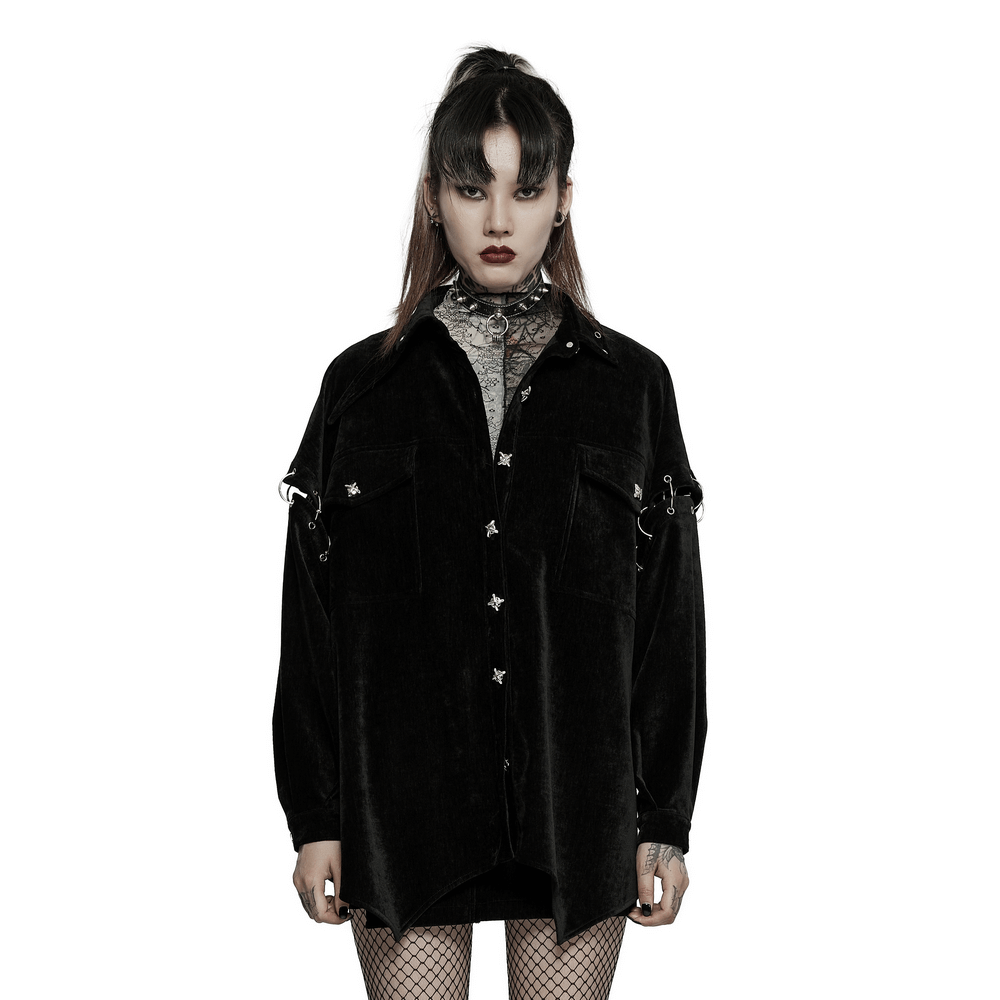 Model showcasing a velvet punk shirt with detachable sleeves and iron rings, styled for an edgy, relaxed look.