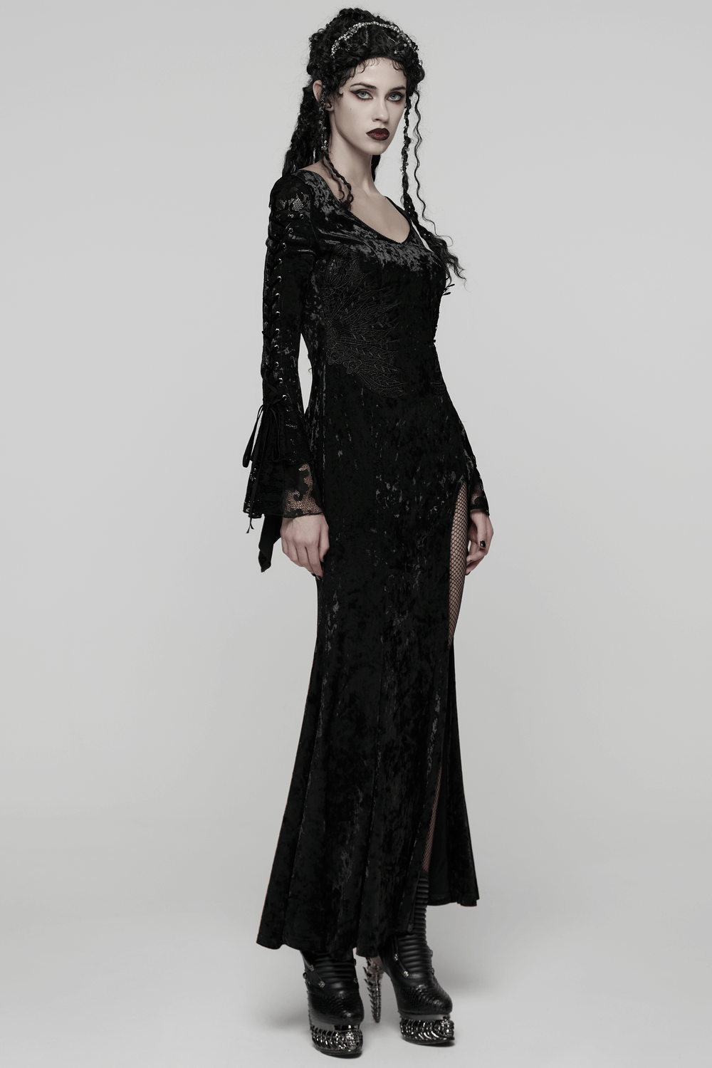 Velvet Lace Dress with Fishtail Sleeves and High Slit worn by model with punk style hair and aesthetic.