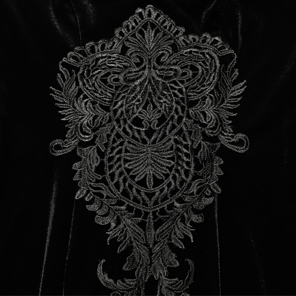 Intricate black decal detail on velvet fabric, showcasing elegant gothic embroidery design.