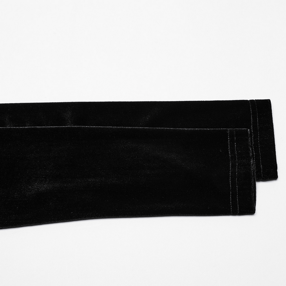 Luxurious black velvet fabric showcasing sleek, smooth jacket sleeves with stylish stitching details.