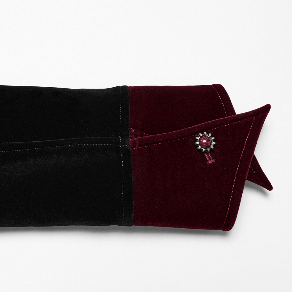 Close-up of the velvet sleeve cuff featuring a burgundy and black design with a gemstone buckle. Elegant gothic detail.